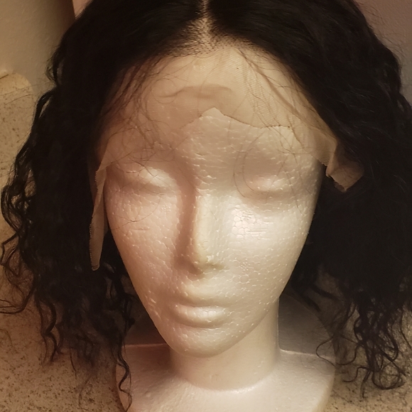Black Curly human hair wig. 14 inches bob cut.